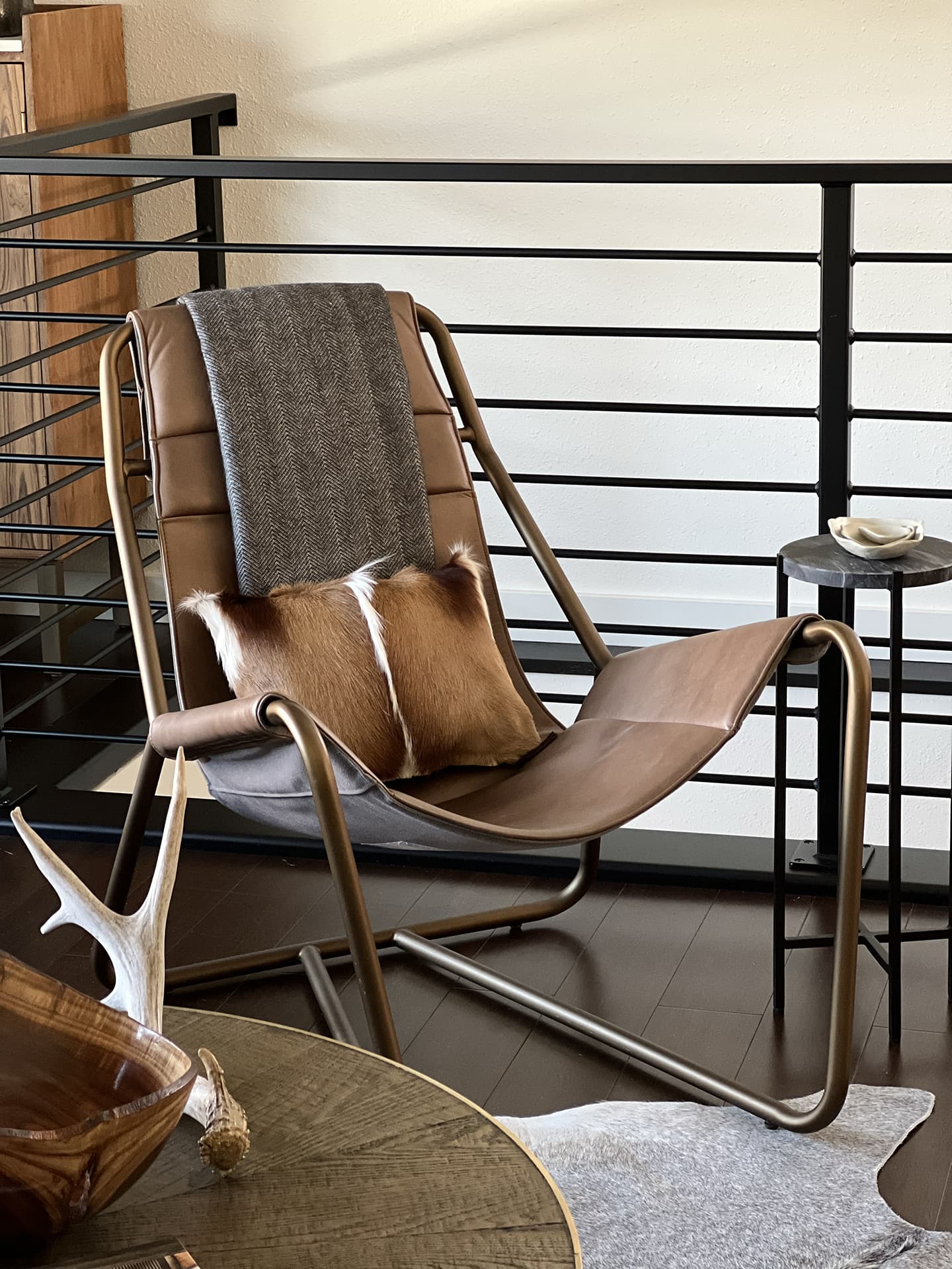 Nida Risto Interior Design in Jackson Hole Wood and Whiskey project detail with chair and fur pillow.